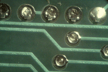 Figure 1: Sunken solder joints caused by outgassing